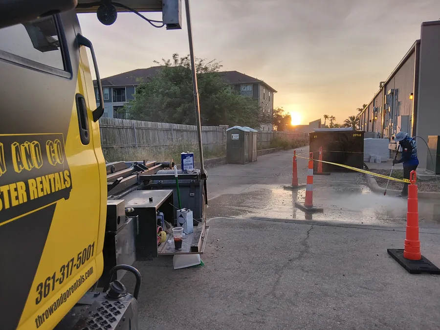 Roll-off dumpster on site for a rental property turnover in Corpus Christi